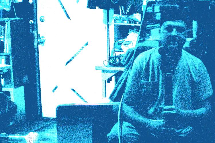 Larry reflecting in the piano